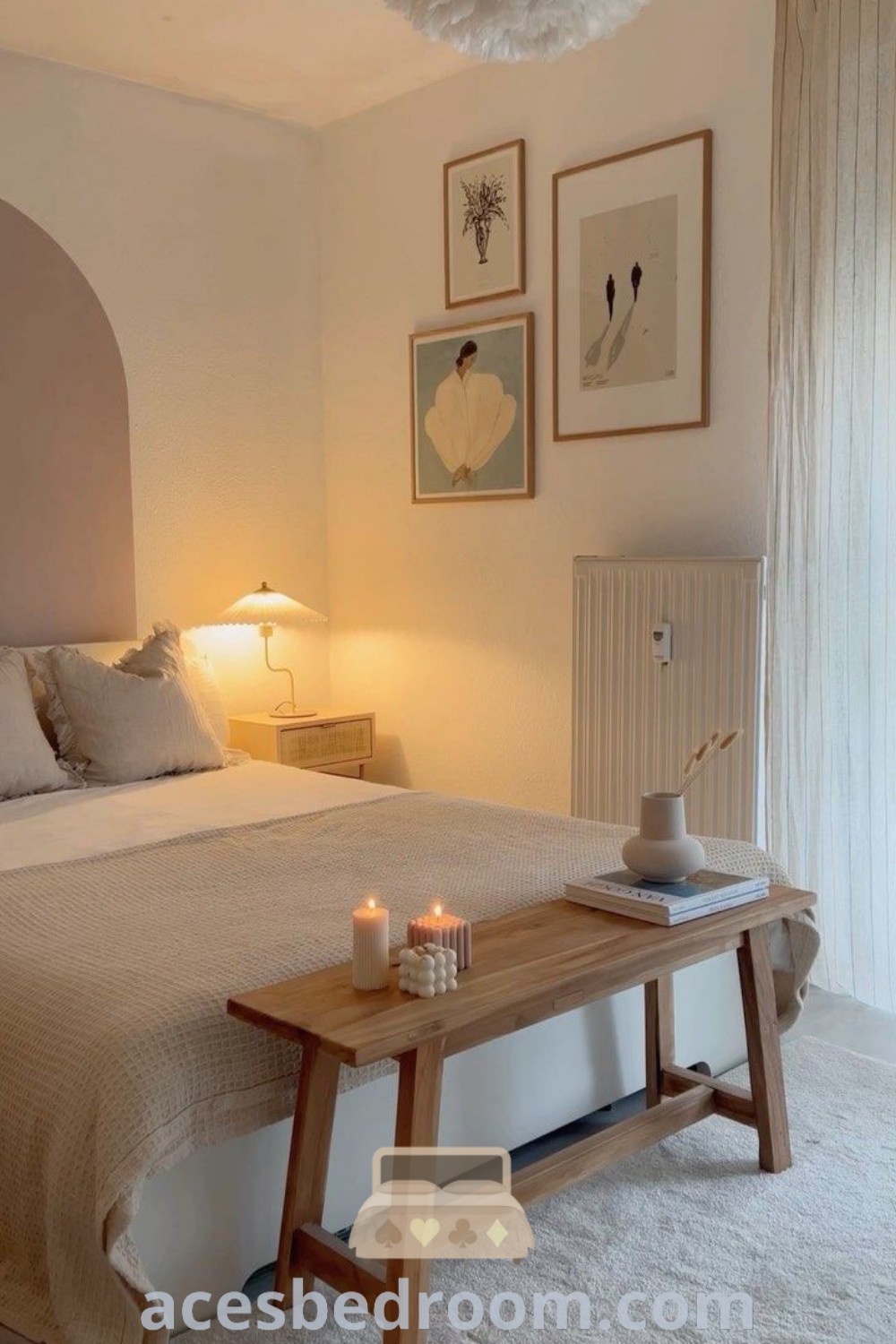 A cozy Scandinavian-style bedroom featuring a neatly made bed, pictures on the wall, and inviting decor ideas that enhance the aesthetic. This inspiring room showcases design ideas perfect for guest bedrooms, offering a warm and sophisticated look. Discover more at acesbedroom.com.