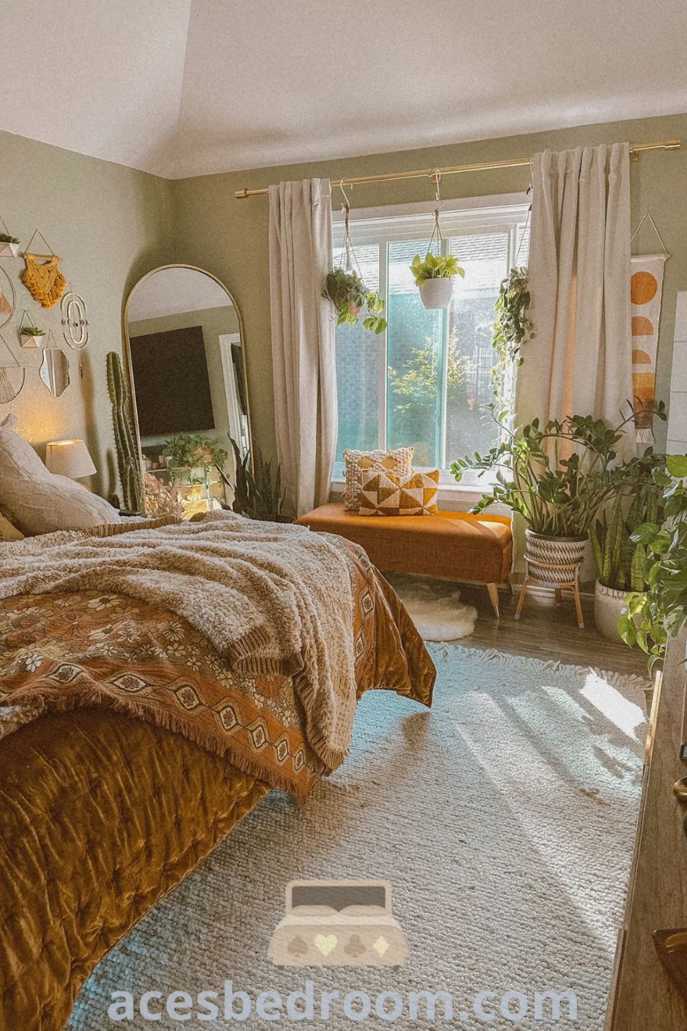 A cozy boho bedroom with a neatly made bed and a large mirror, showcasing inspiring decor ideas that blend earthy aesthetics with artsy elements. This inviting space offers unique design inspirations for your home, creating a warm and sophisticated look. Discover more cozy ideas at acesbedroom.com.