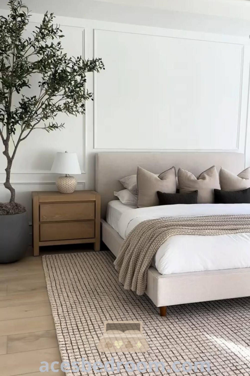 A minimalist bedroom with a wooden bed, light and airy decor elements, and organic modern style, designed for a cozy and sophisticated look. Explore trendy bedroom ideas and inspirations for your home at acesbedroom.com.