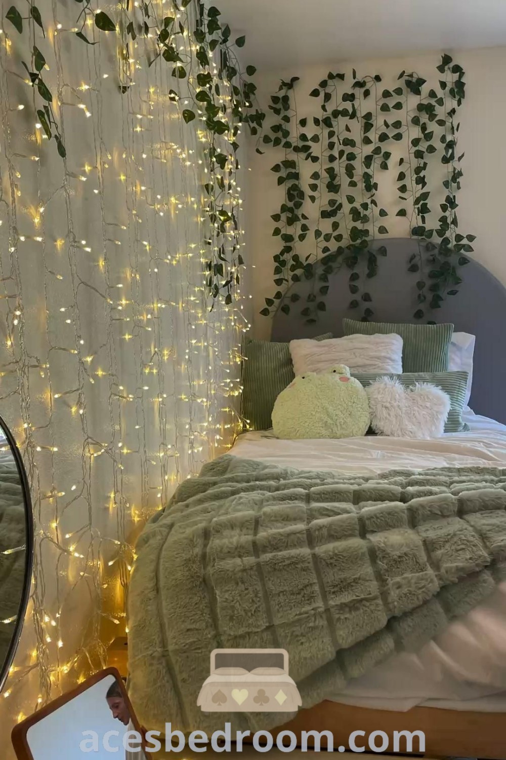 A cozy sage green bedroom featuring a stylish bed with a lighted headboard, offering a perfect blend of comfort and aesthetic appeal. This dorm room style provides decor ideas and inspirations for creating a tranquil space. Discover more unique ideas for your home at acesbedroom.com.